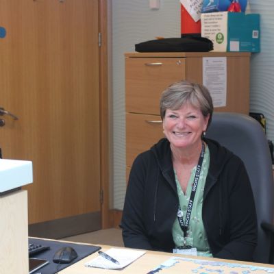 Mrs Boyd on Reception, Hartley Learning Centre